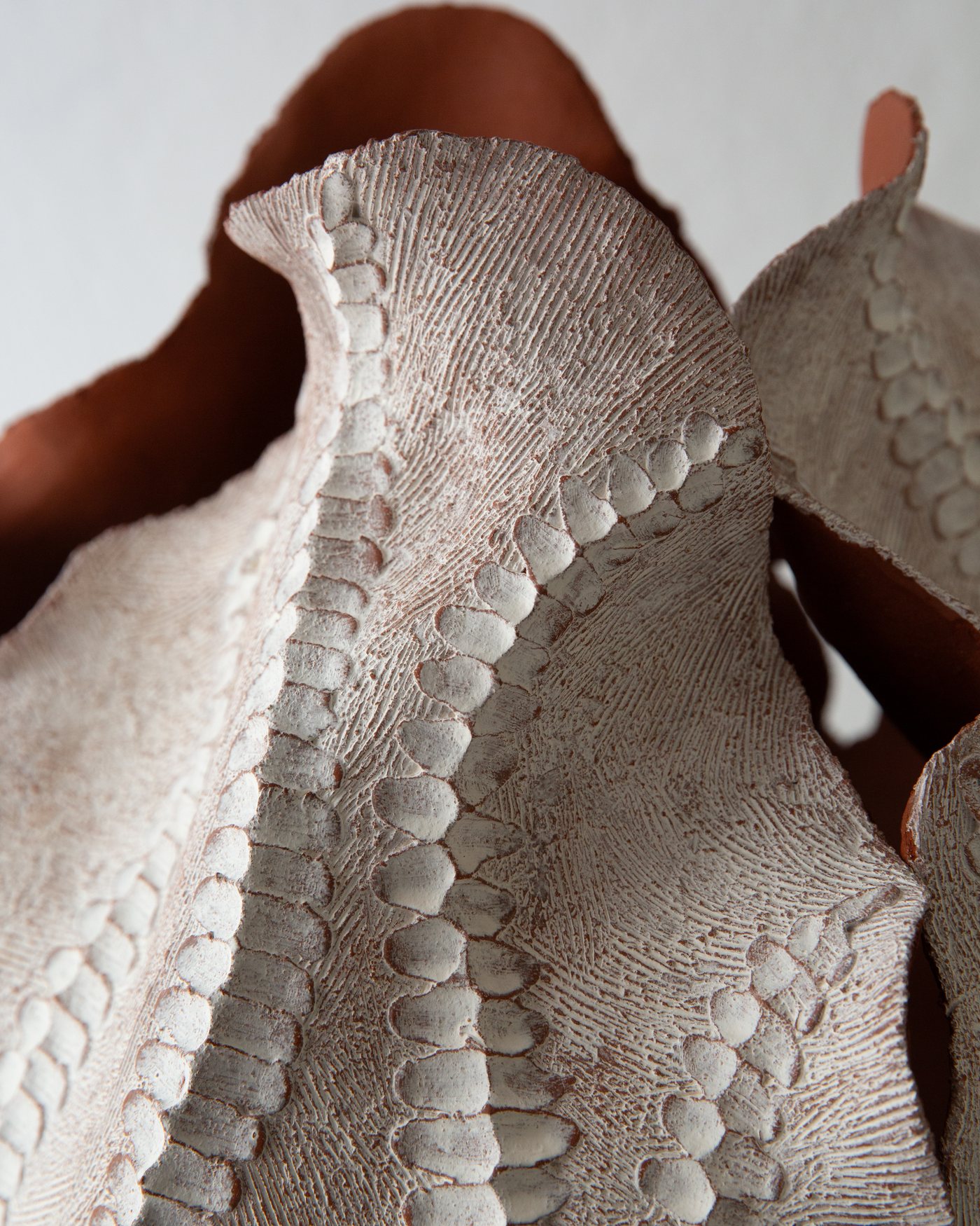 Close detail of ribbed terracotta ceramic texture
