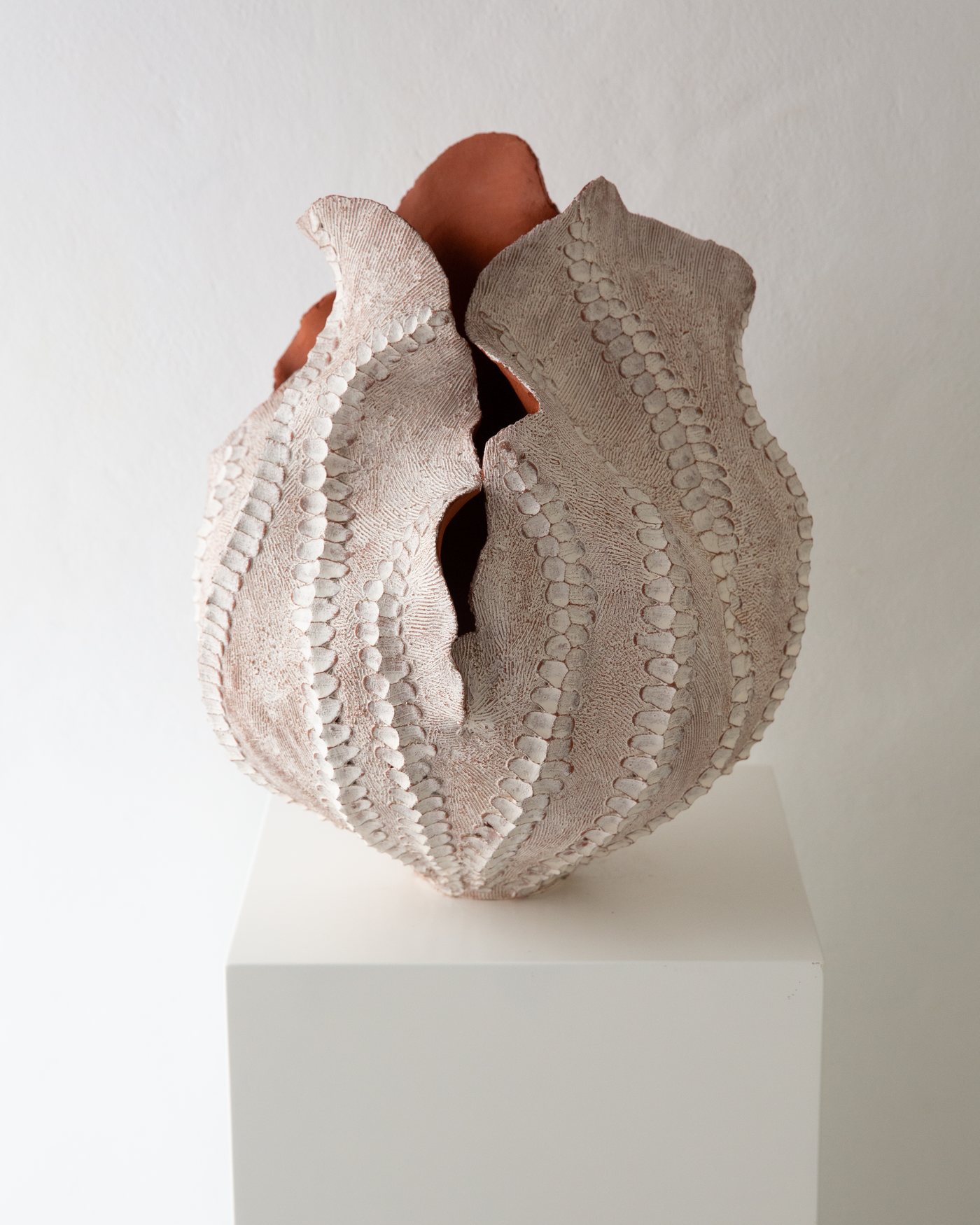 Terracotta and white ribbed ceramic bloom form